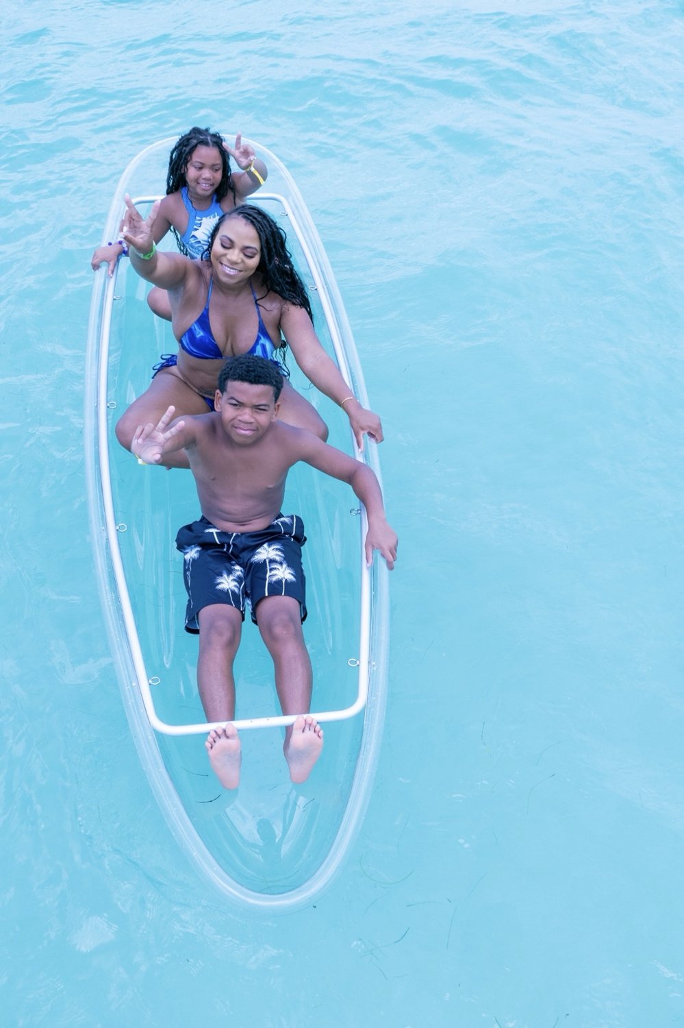 Family enjoying a clear kayak