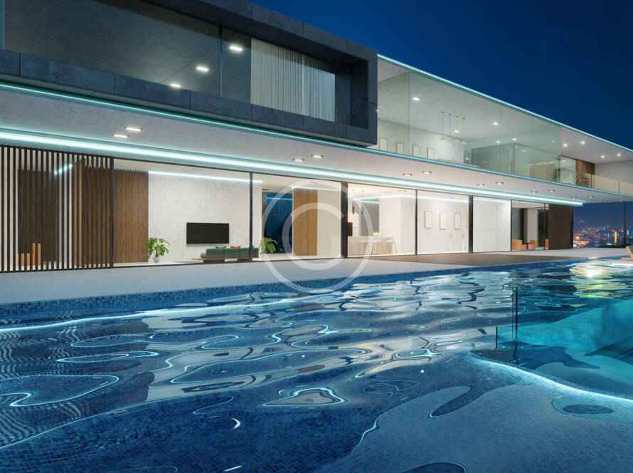 A large swimming pool in front of a house.