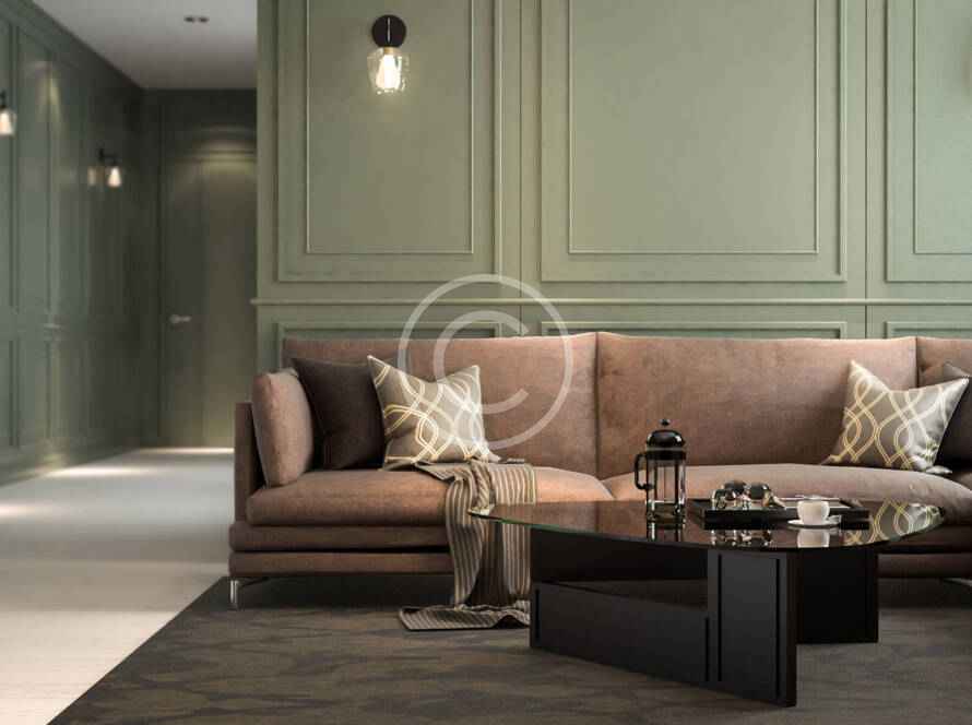A living room with green walls and brown furniture