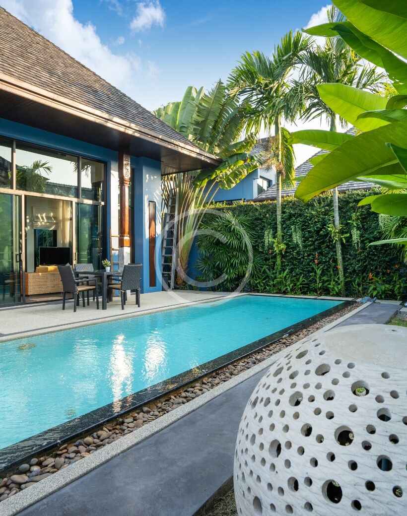 A pool with a view of the back yard.