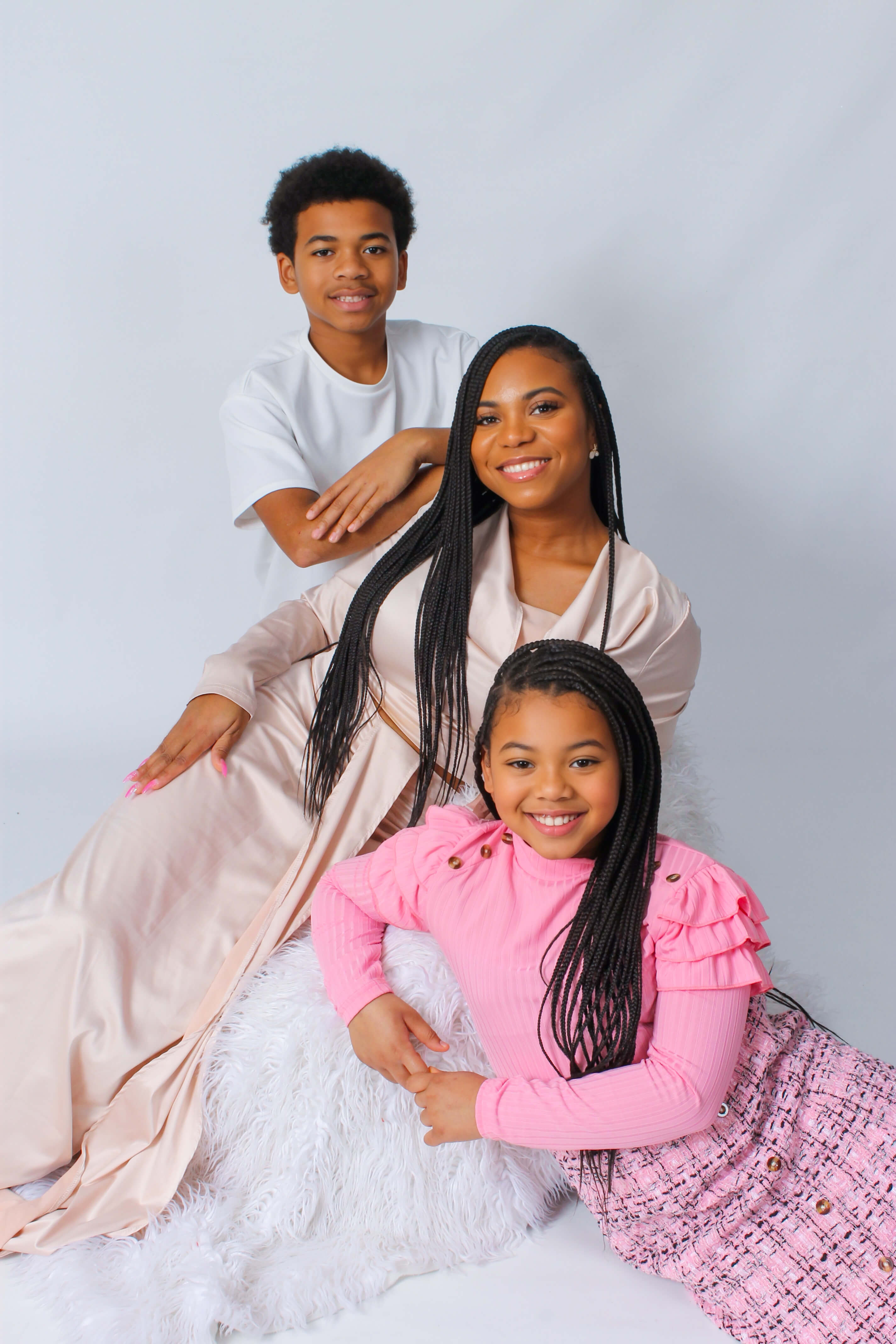 A family posing for a picture in their clothing.