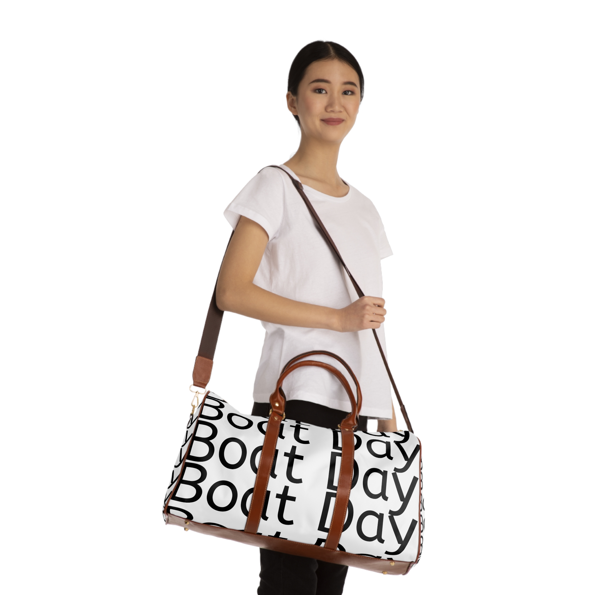 A woman holding onto the strap of her bag