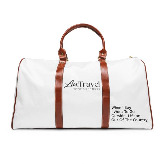 A white duffel bag with brown leather handles.
