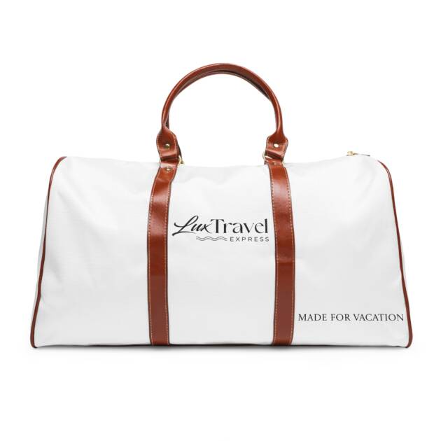 A white duffel bag with brown leather handles.